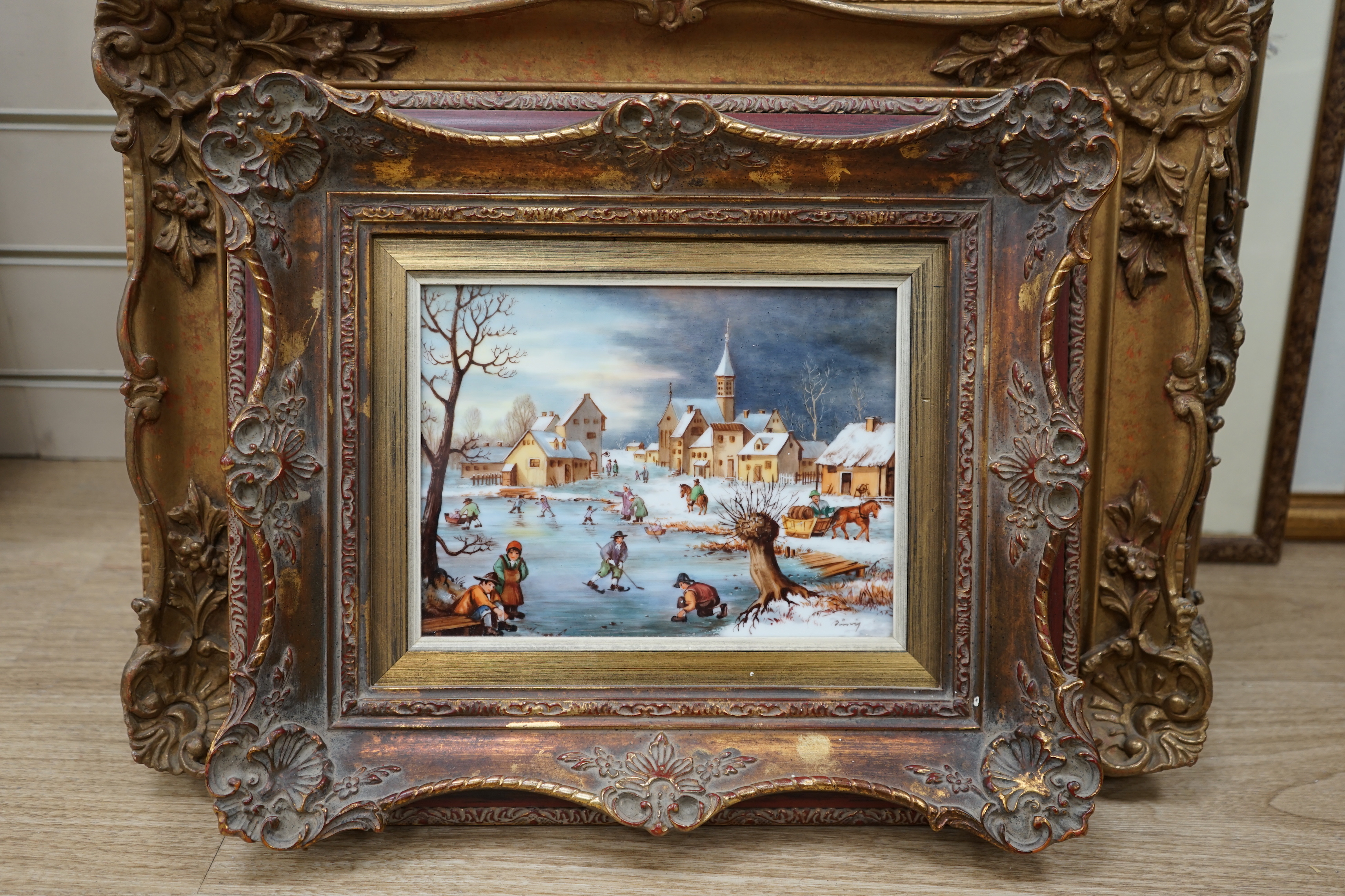 A West German porcelain plaque hand painted with a winter landscape and figures skating, indistinctly signed, 17 x 23cm